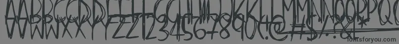 Scraggly-fontti – mustat fontit harmaalla taustalla