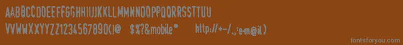 フォントTraumaSw – 茶色の背景に灰色の文字