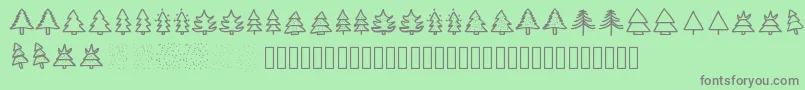 フォントChristmastrees – 緑の背景に灰色の文字