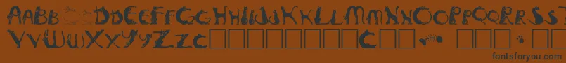 Pussyfoota-Schriftart – Schwarze Schriften auf braunem Hintergrund