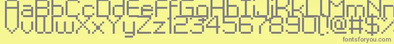フォントKyrou9Regular – 黄色の背景に灰色の文字