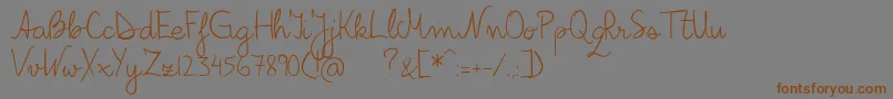 フォントBilius – 茶色の文字が灰色の背景にあります。