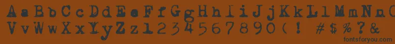 フォントDraconiantypewritter001 – 黒い文字が茶色の背景にあります