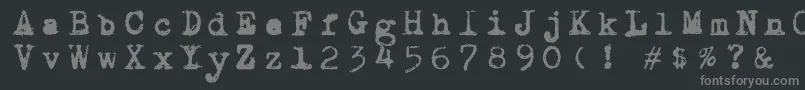 フォントDraconiantypewritter001 – 黒い背景に灰色の文字