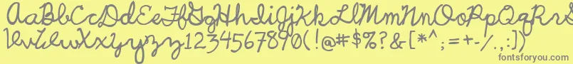 UcuCharlesScript-fontti – harmaat kirjasimet keltaisella taustalla