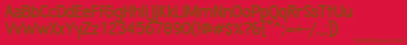 WumbologyBold-Schriftart – Braune Schriften auf rotem Hintergrund