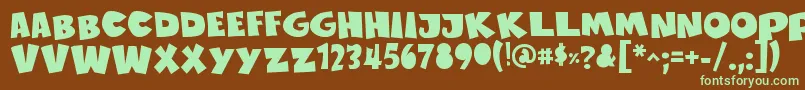 フォントSustainableAmazonIi – 緑色の文字が茶色の背景にあります。