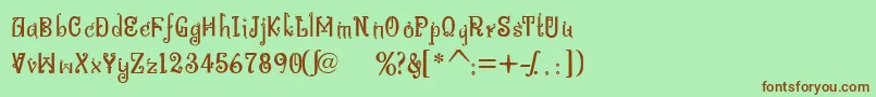 フォントBitlingniksmusicalNormal – 緑の背景に茶色のフォント