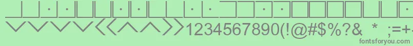 フォントIlluminatiMasonicCipher – 緑の背景に灰色の文字