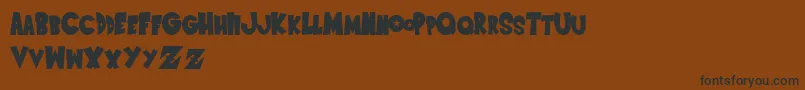 SaiyanSans Font – Black Fonts on Brown Background