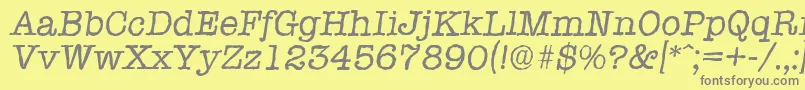 TypewriterantiqueItalic-fontti – harmaat kirjasimet keltaisella taustalla