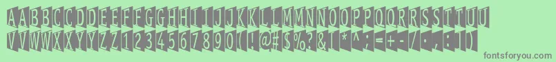 Stageglyphs Font – Gray Fonts on Green Background
