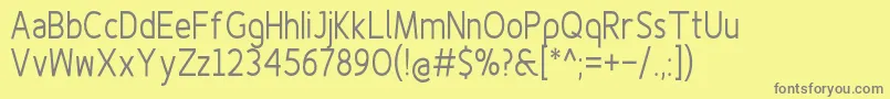 Finenessproregularcond-fontti – harmaat kirjasimet keltaisella taustalla