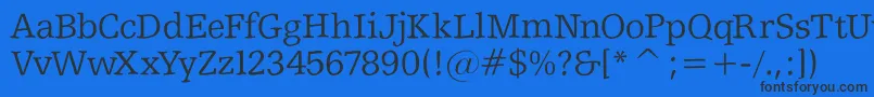 Shakeyslabserif-fontti – mustat fontit sinisellä taustalla