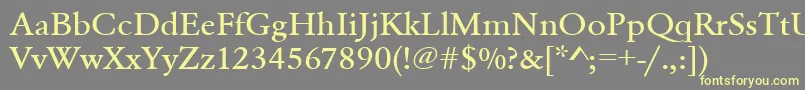 Urwgaramondtmedextwid-Schriftart – Gelbe Schriften auf grauem Hintergrund