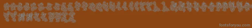 Vtks Beauty-Schriftart – Graue Schriften auf braunem Hintergrund