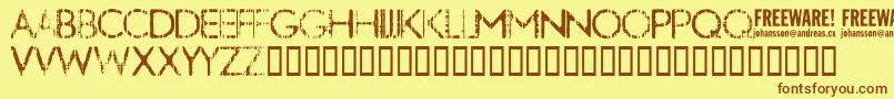 フォントNobby ffy – 茶色の文字が黄色の背景にあります。