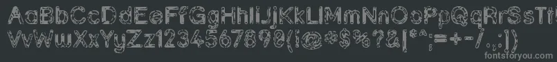 Grunja-fontti – harmaat kirjasimet mustalla taustalla