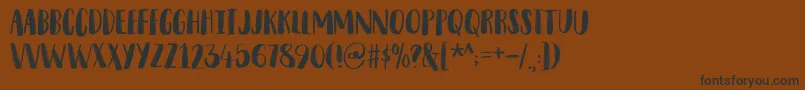 SnubnoseDemo Font – Black Fonts on Brown Background
