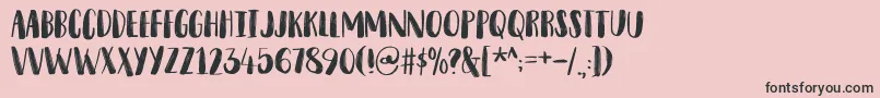 フォントSnubnoseDemo – ピンクの背景に黒い文字