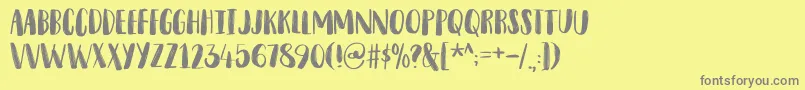 Шрифт SnubnoseDemo – серые шрифты на жёлтом фоне