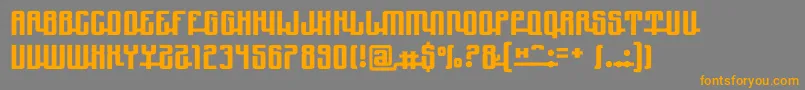 フォントYndupro – オレンジの文字は灰色の背景にあります。