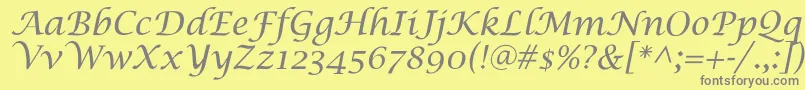 SaintgermainCalligraphy-fontti – harmaat kirjasimet keltaisella taustalla