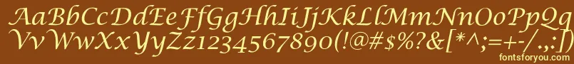 SaintgermainCalligraphy-fontti – keltaiset fontit ruskealla taustalla