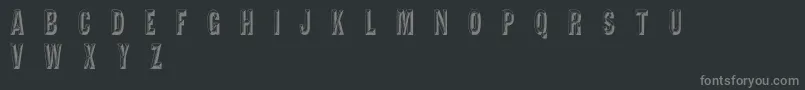 TejaratchiCn-fontti – harmaat kirjasimet mustalla taustalla
