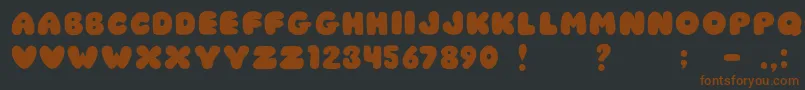 JiChubbyCaps-Schriftart – Braune Schriften auf schwarzem Hintergrund