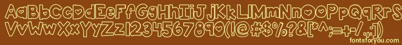 Kbtwolovers-fontti – keltaiset fontit ruskealla taustalla