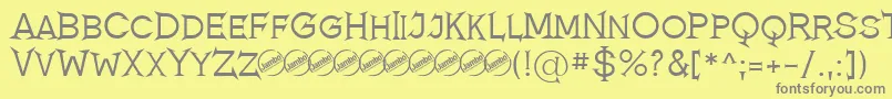 フォントRomanicumRegular – 黄色の背景に灰色の文字