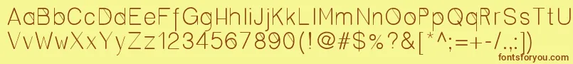 フォントCero – 茶色の文字が黄色の背景にあります。