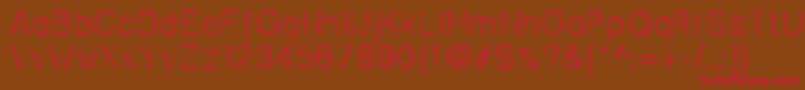 フォントCero – 赤い文字が茶色の背景にあります。