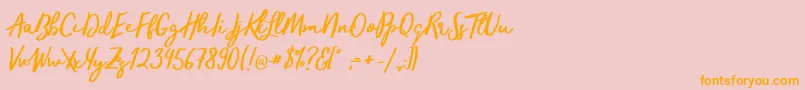 フォントTrendsetterRegular – オレンジの文字がピンクの背景にあります。