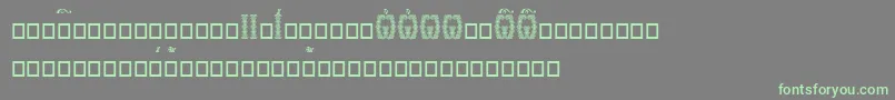 Orthodox.TtUcs8DropCaps-Schriftart – Grüne Schriften auf grauem Hintergrund