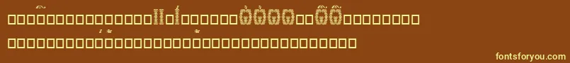 Orthodox.TtUcs8DropCaps-fontti – keltaiset fontit ruskealla taustalla