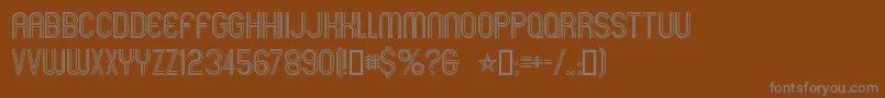 Mexcellent-Schriftart – Graue Schriften auf braunem Hintergrund