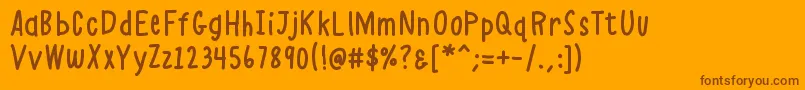 Czcionka K26alphacasual – brązowe czcionki na pomarańczowym tle