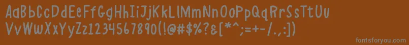 K26alphacasual-Schriftart – Graue Schriften auf braunem Hintergrund
