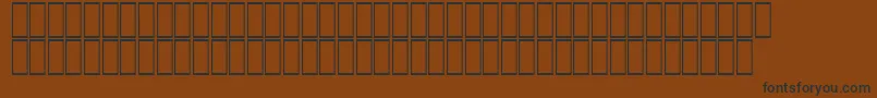 Czcionka AcsTopazzExtraBold – czarne czcionki na brązowym tle