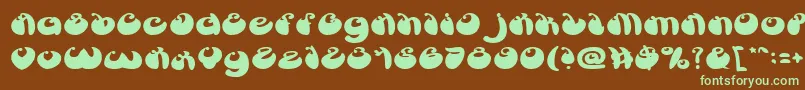 フォントButterflyBold – 緑色の文字が茶色の背景にあります。