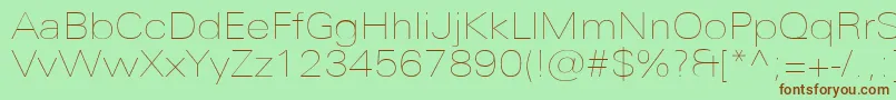 UniversNextProUltralightExtended-fontti – ruskeat fontit vihreällä taustalla