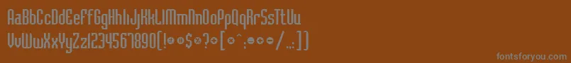フォントBadlocicg – 茶色の背景に灰色の文字