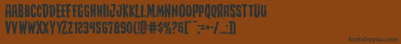 Creepycrawlersexpand Font – Black Fonts on Brown Background