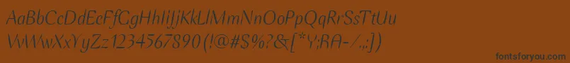 フォントEllipseItcItalic – 黒い文字が茶色の背景にあります