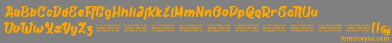 GatalikePersonalUse-Schriftart – Orangefarbene Schriften auf grauem Hintergrund