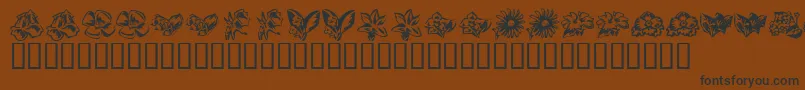 フォントKrBeautifulFlowers3 – 黒い文字が茶色の背景にあります