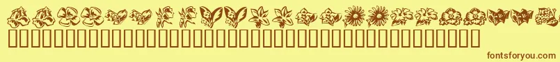 フォントKrBeautifulFlowers3 – 茶色の文字が黄色の背景にあります。