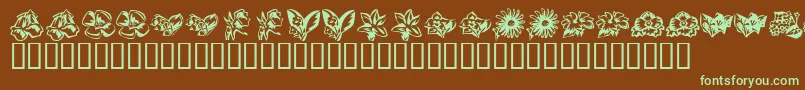 フォントKrBeautifulFlowers3 – 緑色の文字が茶色の背景にあります。